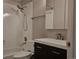 Updated bathroom with tub and modern vanity at 886 Summer Dr, Highlands Ranch, CO 80126