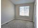 Empty carpeted bedroom with window at 886 Summer Dr, Highlands Ranch, CO 80126
