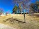 A community space featuring a grassy hill with trees and clear blue skies at 886 Summer Dr, Highlands Ranch, CO 80126