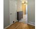 Welcoming entryway features hardwood floors, storage cabinet and convenient pet access door at 886 Summer Dr, Highlands Ranch, CO 80126