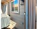 Exterior view with a grill and a window reflecting cars outside of the house at 886 Summer Dr, Highlands Ranch, CO 80126