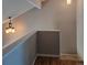 Well-lit hallway with decorative chandelier at 886 Summer Dr, Highlands Ranch, CO 80126