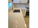 Close-up of the kitchen featuring Quartz countertops, modern faucet, and stainless steel sink at 886 Summer Dr, Highlands Ranch, CO 80126