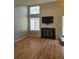 Bright living room features hardwood floors, a fireplace, and ample natural light at 886 Summer Dr, Highlands Ranch, CO 80126