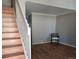 Bright living room featuring hardwood floors and a staircase at 886 Summer Dr, Highlands Ranch, CO 80126