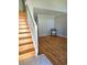 Spacious living area with hardwood floors and a staircase at 886 Summer Dr, Highlands Ranch, CO 80126