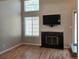 Bright living room featuring a modern fireplace and large windows at 886 Summer Dr, Highlands Ranch, CO 80126