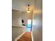 View of the staircase with modern light fixture and natural light at 886 Summer Dr, Highlands Ranch, CO 80126