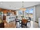 Cozy dining area with an island and a lot of natural light at 745 Penstemon Dr, Henderson, CO 80640