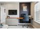 Home office area with sleek furniture, modern decor, and a lot of light at 745 Penstemon Dr, Henderson, CO 80640