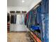 Organized walk-in closet with ample storage space for clothes and accessories at 745 Penstemon Dr, Henderson, CO 80640