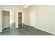 Bright bedroom with mirrored closet doors and a ceiling fan at 9617 W Chatfield Ave # E, Littleton, CO 80128