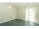 Bright room with vertical blinds and balcony access at 9617 W Chatfield Ave # E, Littleton, CO 80128