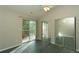 Bedroom with sliding glass door to balcony and mirrored closet at 9617 W Chatfield Ave # E, Littleton, CO 80128