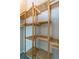 Walk-in closet with built in shelving at 9617 W Chatfield Ave # E, Littleton, CO 80128