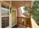 Balcony view showcasing the front door, address, and natural light from the large window at 9617 W Chatfield Ave # E, Littleton, CO 80128