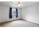 Bedroom with plush carpeting, a ceiling fan, a window with view at 5596 S Urban St, Littleton, CO 80127