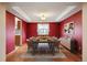 Dining room featuring wood floors, modern furniture, and a decorative ceiling at 5596 S Urban St, Littleton, CO 80127
