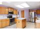 Cozy kitchen featuring stainless steel appliances and lots of storage at 5596 S Urban St, Littleton, CO 80127