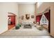 Bright living room with high ceilings, neutral decor, large windows and comfortable furniture at 5596 S Urban St, Littleton, CO 80127
