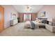 Stylish main bedroom with ensuite bathroom and coordinated decor at 5596 S Urban St, Littleton, CO 80127
