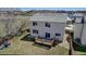 Large backyard featuring a deck, well-manicured lawn, and privacy fencing at 19593 E Hollow Creek Dr, Parker, CO 80134