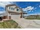 Beautiful two-story home with a covered front porch, attached garage, and well-kept lawn at 19593 E Hollow Creek Dr, Parker, CO 80134