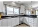 Bright kitchen featuring granite counters, a stainless dishwasher, and ample cabinet space at 19593 E Hollow Creek Dr, Parker, CO 80134