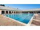 Outdoor community swimming pool with lounge chairs, perfect for relaxing on a hot day at 19593 E Hollow Creek Dr, Parker, CO 80134