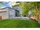 Backyard with a green lawn and patio, perfect for outdoor dining and relaxation with Gathering and friends at 6760 Mariposa Ct, Denver, CO 80221