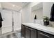 Modern bathroom featuring a glass-enclosed shower and stylish vanity with ample counter space at 6760 Mariposa Ct, Denver, CO 80221