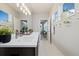 Bright bathroom with double sink vanity, modern lighting and large windows at 6760 Mariposa Ct, Denver, CO 80221