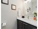 Cozy half-bathroom with vanity and mirror at 6760 Mariposa Ct, Denver, CO 80221