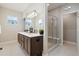 Elegant bathroom featuring a double vanity with modern fixtures and a glass shower at 6760 Mariposa Ct, Denver, CO 80221