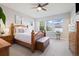 Inviting bedroom with hardwood furniture and a large window showcasing neighborhood views at 6760 Mariposa Ct, Denver, CO 80221