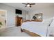 Cozy bedroom featuring a large window and hardwood furniture at 6760 Mariposa Ct, Denver, CO 80221