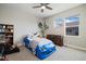 Fun bedroom with ceiling fan, natural lighting, and blue race car bed at 6760 Mariposa Ct, Denver, CO 80221