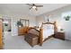 Comfortable bedroom featuring hardwood furniture and natural lighting, perfect for relaxation at 6760 Mariposa Ct, Denver, CO 80221