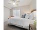 Bright bedroom with a large window and ceiling fan, creating a comfortable and airy space at 6760 Mariposa Ct, Denver, CO 80221