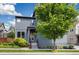Charming two-story home featuring modern architecture, a well-manicured lawn, and lush landscaping at 6760 Mariposa Ct, Denver, CO 80221