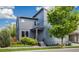 Charming two-story home featuring modern architecture, a well-manicured lawn, and lush landscaping at 6760 Mariposa Ct, Denver, CO 80221