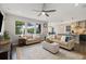Open concept living room featuring lots of natural light, and access to the kitchen at 6760 Mariposa Ct, Denver, CO 80221