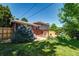 Sizable backyard with a patio and mature blue spruce at 4660 E Briarwood Pl, Centennial, CO 80122