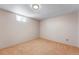 Cozy bedroom featuring neutral walls and plush carpeting at 4660 E Briarwood Pl, Centennial, CO 80122