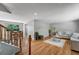 Inviting living room features hardwood floors, neutral paint, and ample natural light and adjoins the dining area at 4660 E Briarwood Pl, Centennial, CO 80122
