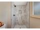 Marble shower with matte black hardware and a built-in niche at 4660 E Briarwood Pl, Centennial, CO 80122