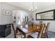 Elegant dining room featuring a large table, comfortable seating, and natural light at 9772 Clairton Pl, Highlands Ranch, CO 80126