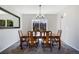 Bright dining room with a wooden table, seating for six, and a window overlooking the backyard at 9772 Clairton Pl, Highlands Ranch, CO 80126