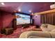 Home theater features projector, large screen, colorful carpeting, and comfortable seating at 9772 Clairton Pl, Highlands Ranch, CO 80126