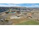 A high angle view shows neighborhood amenities, featuring a pool, recreation center, amphitheater and green space at 6055 Point Rider Cir, Castle Rock, CO 80104